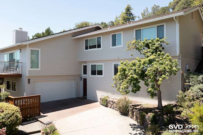 Home exterior featuring James Hardie siding in Cobble Stone and Andersen windows in San Rafael, CA