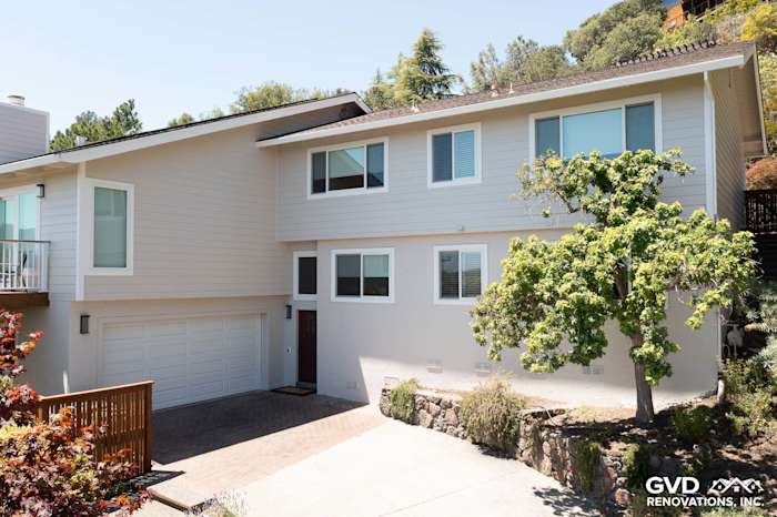 Contemporary home exterior featuring James Hardie siding in Cobble Stone and new Andersen windows in San Rafael