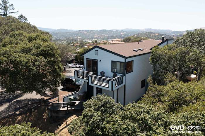 Two-story home in San Rafael featuring Arctic White James Hardie siding and a modern balcony