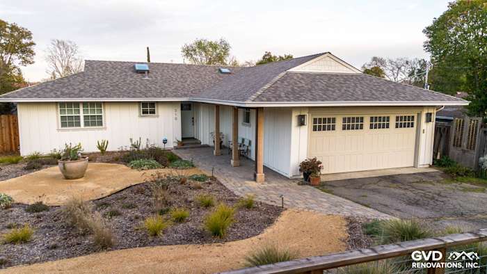 Modern home exterior in Pleasant Hill showcasing James HardiePanel Vertical Siding in Arctic White with new landscaping