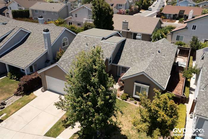 View of a Foster City home featuring James Hardie Artisan Lap Siding in Khaki Brown and Arctic White trim
