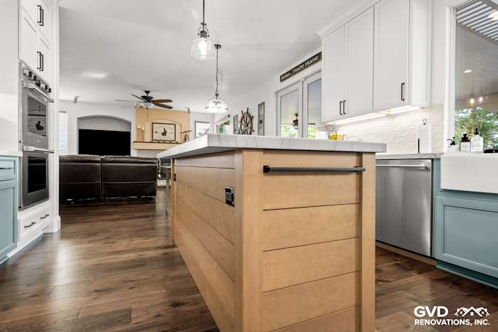 Modern kitchen remodel featuring a Maple Tarragon island, white quartzite countertops, and elegant cabinetry in Roseville, CA