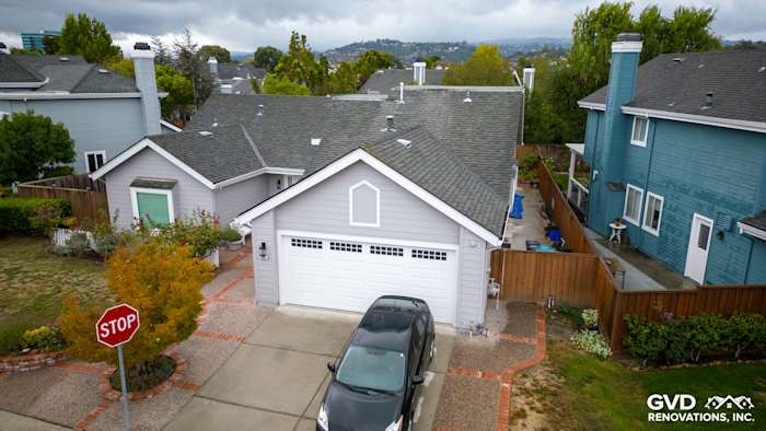 Home exterior showcasing new Pearl Gray James Hardie siding and Milgard windows in Foster City, CA