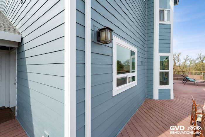 Newly installed James Hardie siding in soft blue tones, showcasing a corner view of the home in Shingle Springs, CA