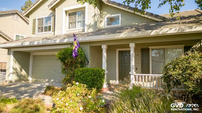 Home exterior in Petaluma with Evening Blue HardiePlank siding, Arctic White trim, and Milgard windows