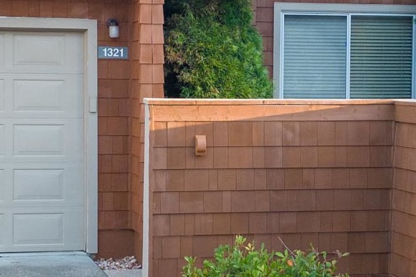 Sonoma home featuring FTX Cedar Sidewall Panel Siding and new Milgard windows, with landscaped front yard