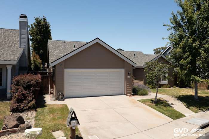 Foster City home featuring James Hardie Artisan Lap Siding in Khaki Brown and Arctic White trim, with a garage
