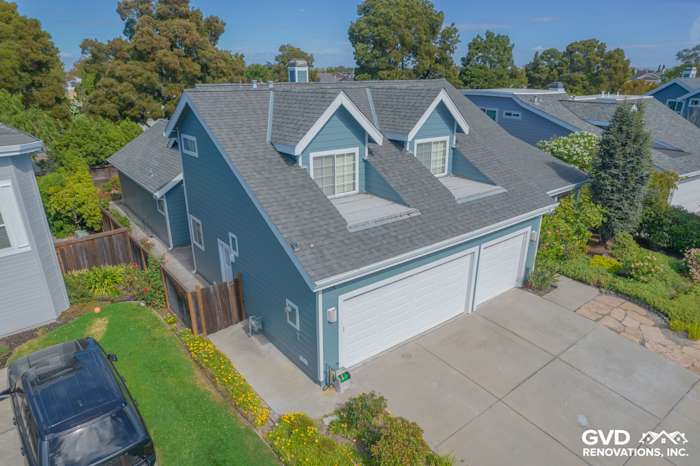 Boothbay Blue James Hardie siding on two-story home with Arctic White trim in Foster City, CA