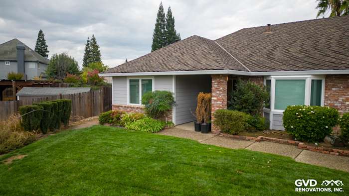 Roseville home exterior featuring James Hardie Cedarmill Siding and Milgard Windows with lush landscaping