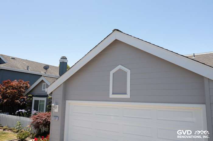Foster City home featuring Pearl Gray James Hardie Plank Lap Siding and Arctic White HardieTrim Boards on garage