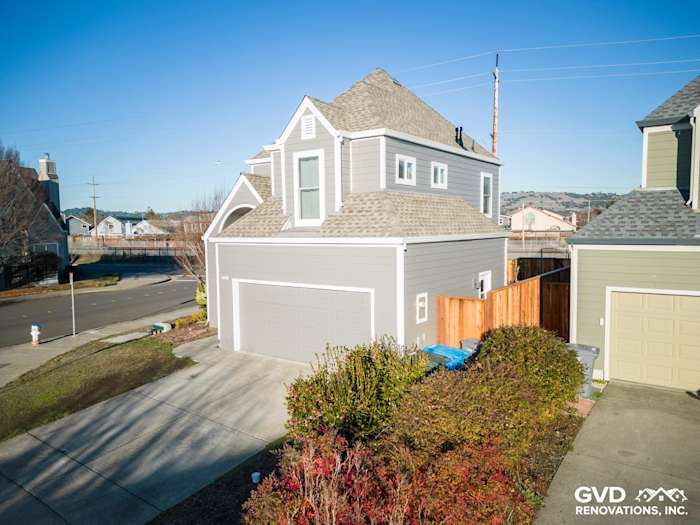 Home exterior featuring Aged Pewter James Hardie siding, modern garage, and vibrant landscaping in Santa Rosa, CA