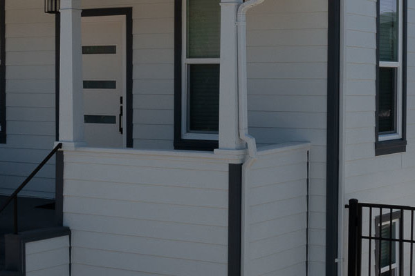 San Leandro home featuring Arctic White James Hardie ColorPlus Lap Siding and Hardie Trim with modern steps