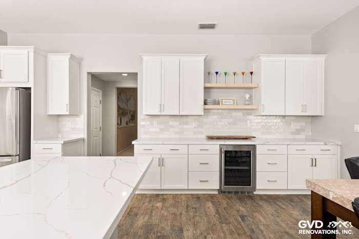 Modern kitchen in Roseville with Diamond cabinets, MSI countertops, and stylish floating shelves