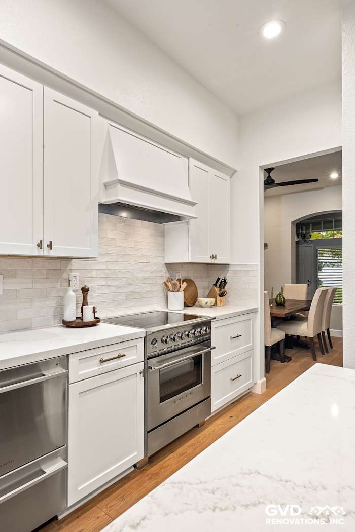 Modern kitchen remodel featuring Waypoint cabinets, Vadara Bronzo countertop, and stylish backsplash in Folsom, CA