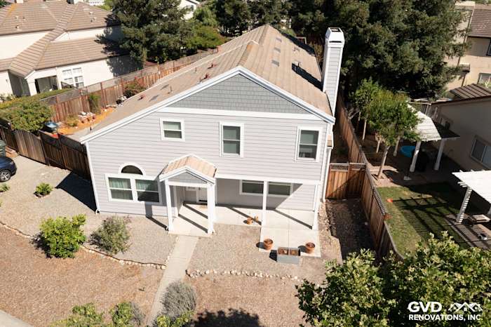 Home exterior featuring Pearl Gray James Hardie siding, Arctic White trim, and landscaped yard in Petaluma