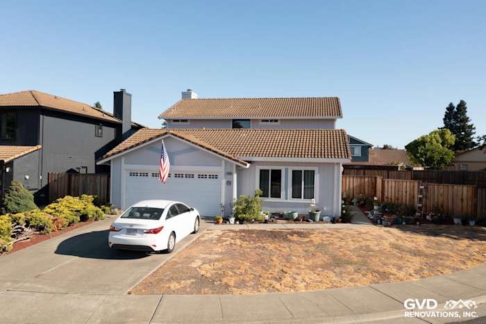 Updated home exterior in Petaluma with new siding, windows, and landscaped yard, enhancing curb appeal