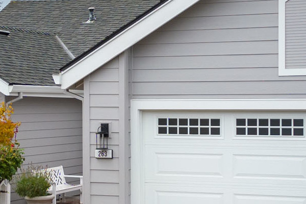 Foster City home's exterior featuring new Pearl Gray James Hardie siding and Milgard windows