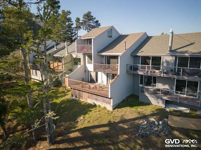 Pearl Gray James Hardie lap siding on unique Mill Valley home, surrounded by trees and neighboring houses