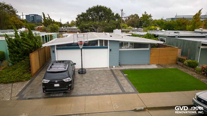 Modern home exterior in San Mateo featuring Boothbay Blue James Hardie siding and Arctic White trim, with basketball hoop