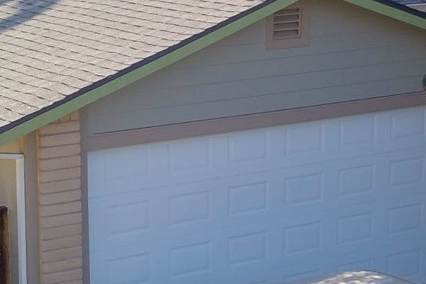 Home exterior featuring Monterey Taupe HardiePlank lap siding with a gray roof and landscaped yard in Orangevale, CA