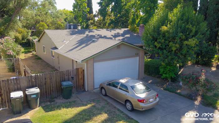 Home exterior featuring Monterey Taupe HardiePlank lap siding with a gray roof and landscaped yard in Orangevale, CA