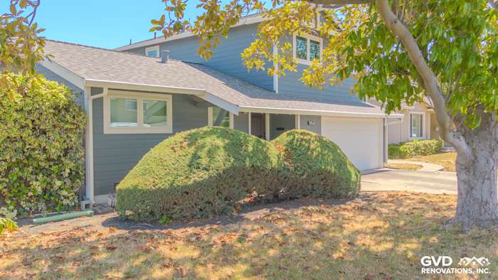 Santa Clara home featuring James Hardie siding in Evening Blue and Arctic White trim under bright sunlight