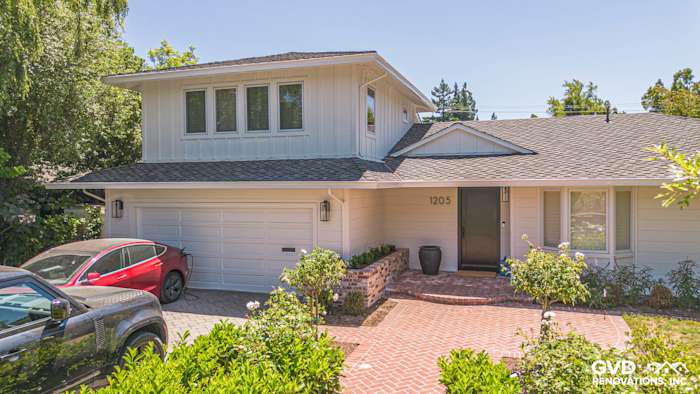 Menlo Park home exterior featuring newly installed James Hardie Batten Board siding and a paved driveway