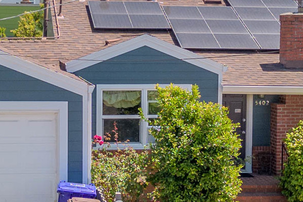 Home exterior featuring James Hardie Lap Siding in Evening Blue with Arctic White trim, showcasing enhanced curb appeal