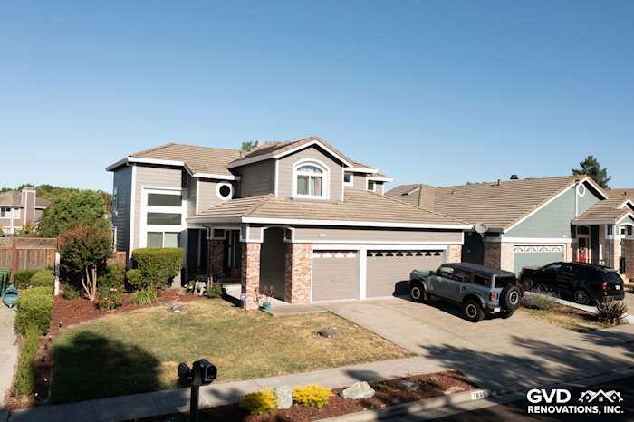 Home exterior in Petaluma with James Hardie Aged Pewter siding, Arctic White trim, and new Alside Mezzo windows