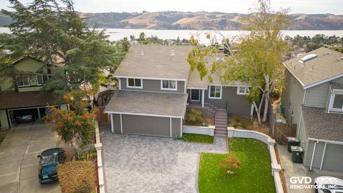 Benicia home exterior featuring Timber Bark HardiePlank siding, Arctic White trim, and paver driveway
