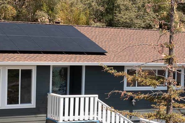 Home exterior showcasing James Hardie Iron Gray siding and Arctic White trim with solar panels in San Rafael