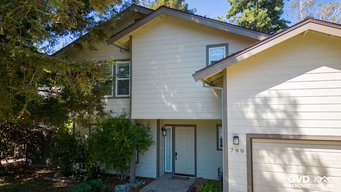 Modern home exterior featuring James Hardie Lap Siding in soft beige and dark trim in Sacramento