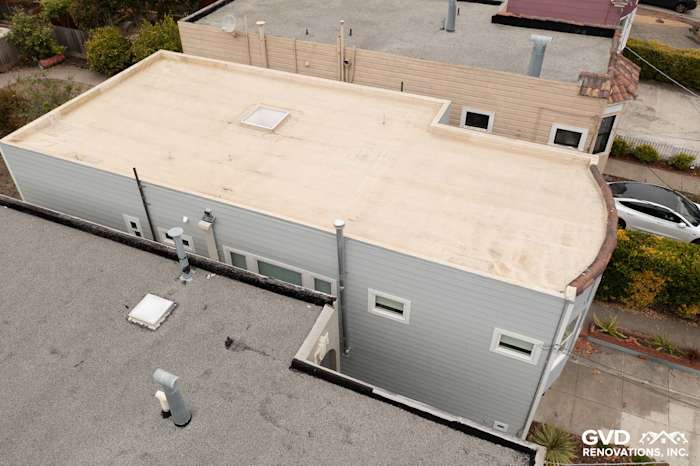 Aerial view of a home exterior showcasing Light Mist James Hardie lap siding with Arctic White trim in San Francisco