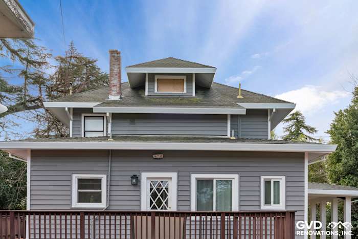 Updated home exterior with gray vinyl siding and white trim, showcasing a remodeled appearance in Dixon, CA