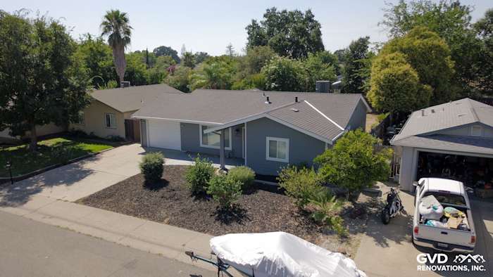 Rocklin home featuring Seal Gray James Hardie siding and Arctic White trim, surrounded by landscaping