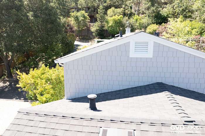Aerial view of a home featuring Pearl Gray James Hardie shingle siding and a dark roof in Orinda