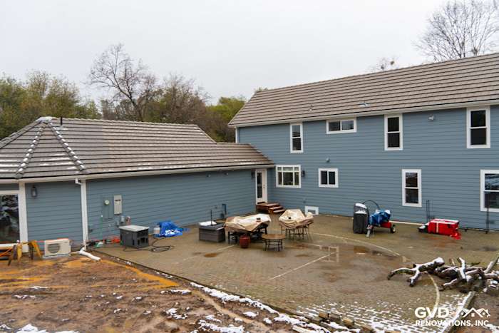 Sutter Creek home featuring Boothbay Blue James Hardie siding and Milgard windows, outdoor patio area visible