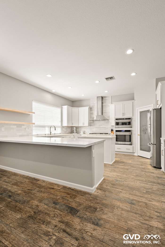 Modern kitchen in Roseville with Diamond cabinets, MSI countertops, and floating shelves, featuring sleek design elements