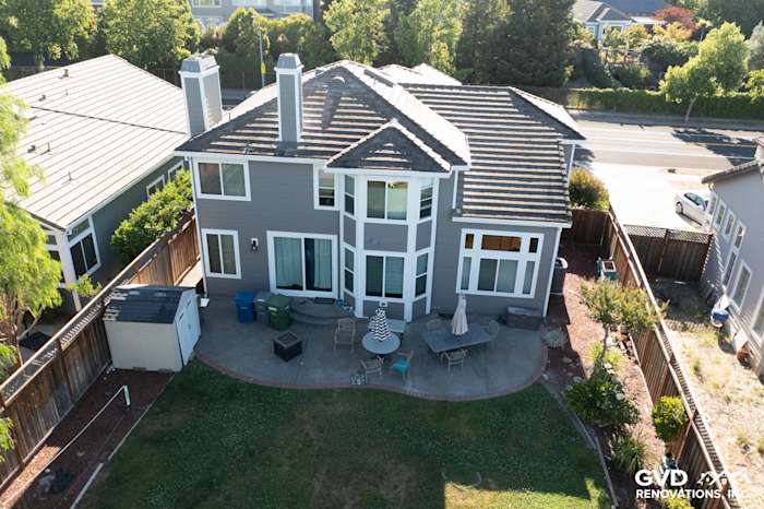 Modern home in Petaluma featuring James Hardie Aged Pewter siding and Alside Mezzo vinyl windows, well-maintained yard