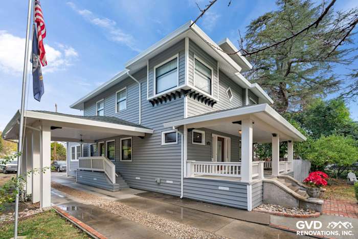 Transformed home exterior featuring light gray vinyl siding, white trim, and a welcoming porch in Dixon, CA