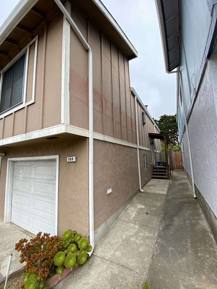 New James Hardie siding installed on home exterior in Daly City, featuring a tan color scheme and updated design
