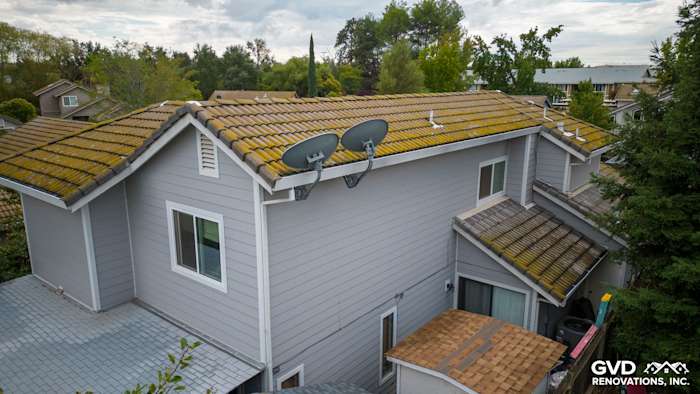 Gray James Hardie Cedarmill siding with Arctic White trim on a home in Rocklin, CA, featuring satellite dishes and a tile