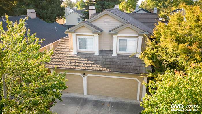 Khaki brown James Hardie lap siding and Alside vinyl windows on a modern home in Santa Rosa, CA