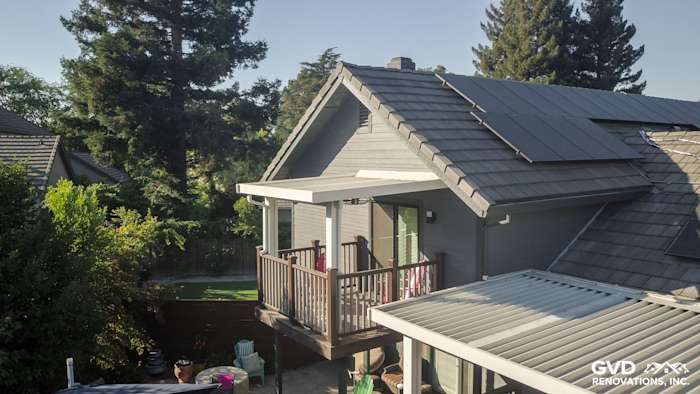 Modern Sacramento home featuring Night Gray HardiePlank siding, solar panels, and a stylish deck