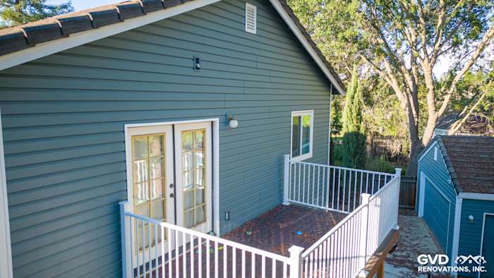 New Alside Prodigy vinyl siding in a calming blue-green tone, complementing a home with a balcony in Folsom
