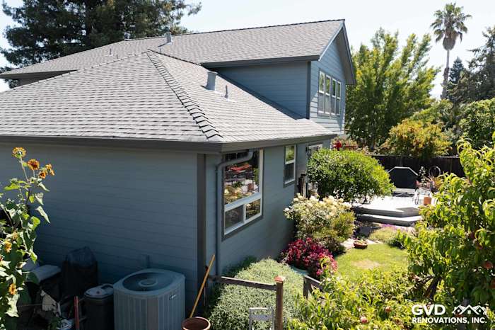 Home exterior showcasing Boothbay Blue James Hardie siding and Milgard windows in Rohnert Park