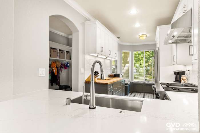 Modern kitchen remodel featuring quartz countertops, stainless steel sink, and stylish cabinetry in Folsom, CA