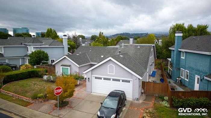 New Pearl Gray James Hardie siding and Milgard windows on a Foster City home exterior with landscaped yard