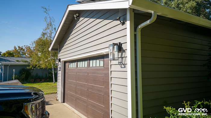 New Alside Prodigy Vinyl Siding in light gray on a garage exterior with Milgard Windows in Carmichael, CA