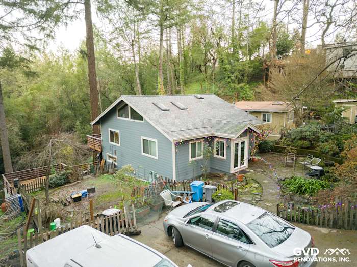 Modern home exterior featuring Boothbay Blue James Hardie siding and white trim in Forestville, CA
